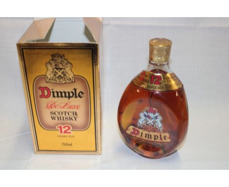 A bottle of Dimple Deluxe 12 year old Scotch whiskey in original box