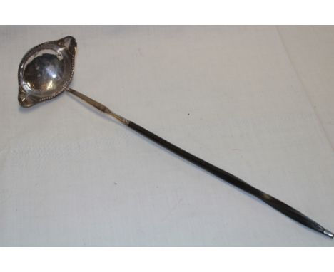 A Georgian silver traditional toddy ladle with whale bone handle, London marks