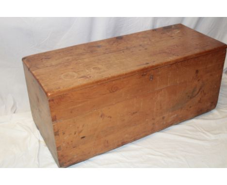 A 19th century pine rectangular trunk with sloping sides and hinged lid, 40" long