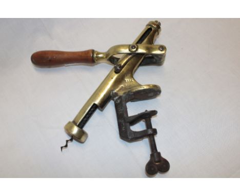 A large brass commercial corkscrew "The Don" with wooden handle and screw mount