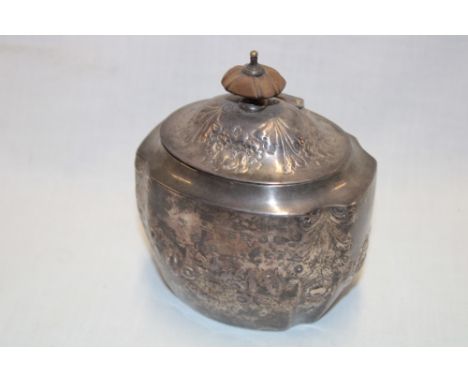 A late Victorian silver shaped-rectangular tea caddy with raised floral decoration and hinged lid, Birmingham marks 1887