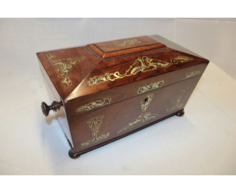 A 19th century mother-of-pearl inlaid rosewood rectangular sarcophagus-shaped tea caddy with internal compartments and mixing
