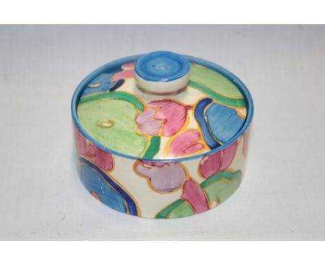 A Clarice Cliff Fantasque Bizarre circular preserve jar and cover with painted floral decoration, 4" diameter