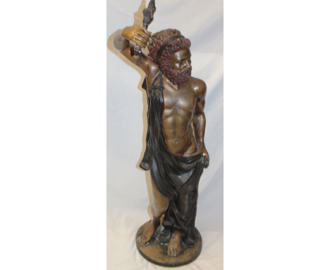 A good quality 20th century bronze figure of a standing bearded male holding a torch aloft, 43" high