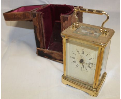 A French carriage clock with rectangular enamelled dial in brass traditional glazed case