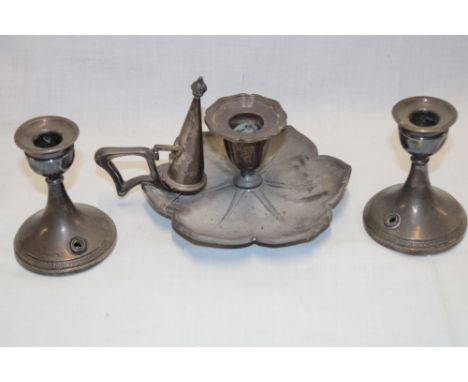 A silver shaped-circular chamber candlestick and snuffer, Sheffield marks and a pair of silver squat-shaped candlesticks, ada