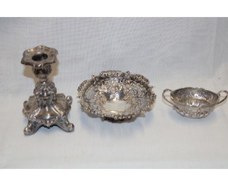 A small silver circular sweetmeat bowl with raised and pierced decoration, Birmingham marks; silver oval two-handled salt wit