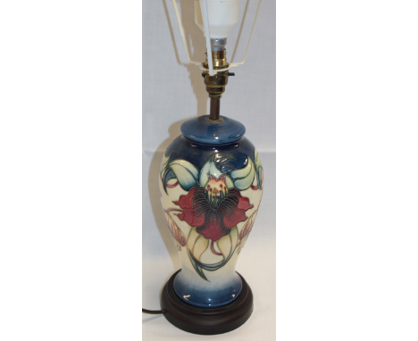 A Moorcroft pottery table lamp with lily decoration, 19" high overall