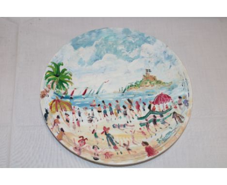 A ceramic circular plate with painted decoration by Simeon Stafford depicting Mounts Bay beach scene with St. Michael's Mount