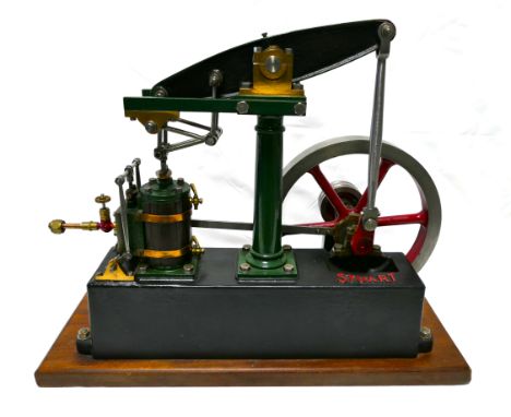 Stuart Turner stationary beam engine, red and green, fly wheel 7" diameter, mounted on wooden base 39 cm x 15 cm, engine heig