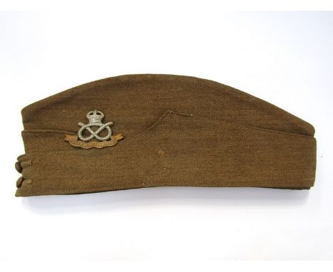 A British Army forage cap with South Staffordshire Regiment badge, the liner marked A&J Gelfer of Glasgow, the date indistinc