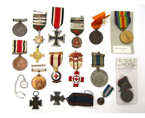 A collection of mixed medals and badges including WWI Victory Medal named to REV. R. STREET, Victoria Jubilee (Metropolitan P