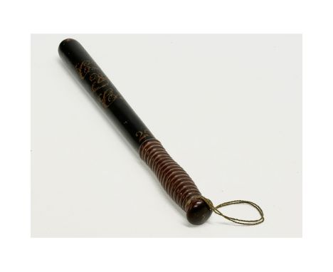 A 19th Century Victorian ebonised truncheon with turned handle. 43cm