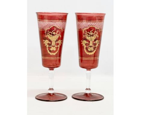 Royal Sheffield Collection. A pair of gilt ruby “Royal Family” wine glasses. 20cm