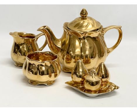 A Mid 20th Century Royal Winton “Golden Age” part tea service. Teapot, crust set, milk jug and sugar bowl. 1930-1950.