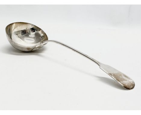 William Eaton. A very large Early 19th Century silver ladle. George IV. London 1829. 200 grams. 34cm (2)