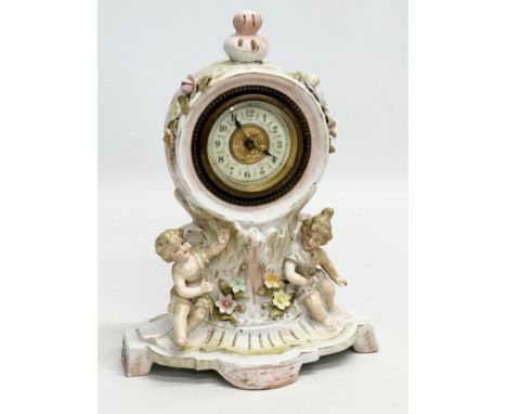 Sitzendorf Porcelain. A Late 19th Century figural mantle clock. Circa 1880-1900. 14x10x20cm