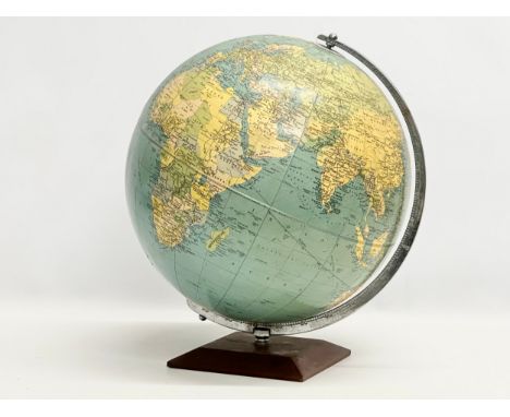 A large 1960’s Philips Challenge Globe on teak base. 36x42cm