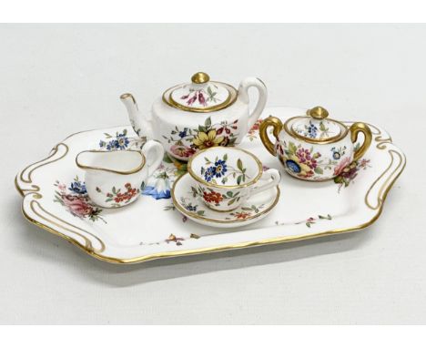 F. Howard for Hammersley. A 1930’s miniature “Howard Sprays” tea service. Signed F. Howard. Tray 20.5cm. Teapot, sugar bowl a