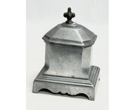 A 19th Century lead tobacco jar/tea caddy. 12.5x9.5x18cm.