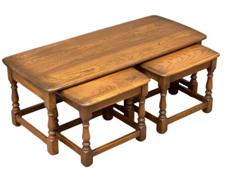 An Ercol “Golden Dawn” coffee table with 2 nesting side tables. 114x50x41cm