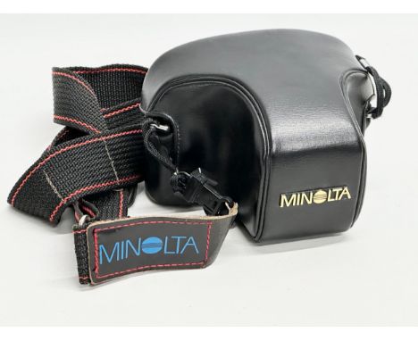 A Minolta X-300 camera with case.