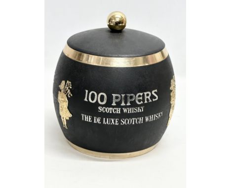 A 100 Pipers Scotch Whisky ice bucket and tongs.