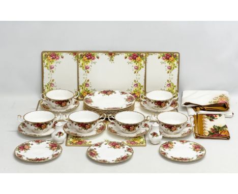 A 31 piece Royal Albert “Old Country Roses” part dinner service. 6 soup bowls, 6 saucers, 3 sandwich plates, 6 table mats, 2 