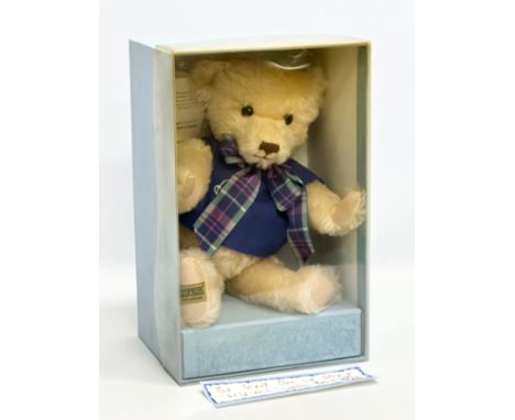 A Merrythought teddy bear with box. Great Ormond Street Children's Hospital.