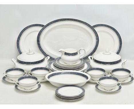 A 36 piece Royal Doulton “Sherbrooke” dinner service. A platter. 6 dinner plates. 2 tureens. Serving bowl. Six 2 handled soup