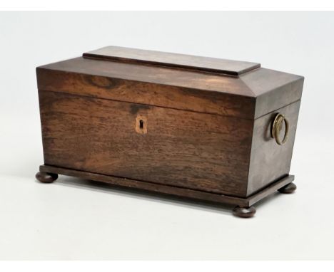 An Early 19th Century Regency Period rosewood sarcophagus tea caddy. Circa 1810. 31x16x18cm
