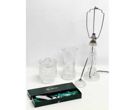 A quantity of Irish crystal. A Waterford desktop paperweight penholder. A Tyrone Crystal table lamp, bases measures 37cm. A G