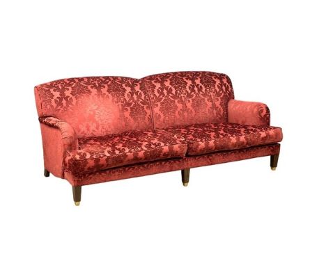A large Victorian style sofa on brass casters. 217cm