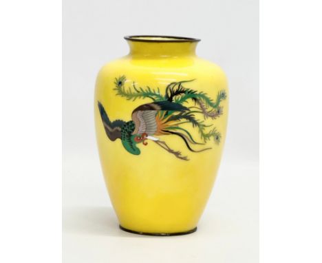 An Early 20th Century Japanese cloisonne enamel baluster vase, with flying phoenix on a glow ground. Late Meiji Period (1868-