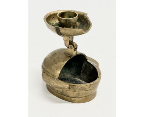 A Late Qing Dynasty Chinese brass folding candleholder. Late 19th/Early 20th Century. Closed 8x7x7cm. Open 11cm tall.