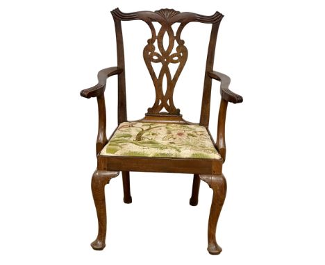 An Early 19th Century George III mahogany armchair. In the Chippendale style. Circa 1800. (7)