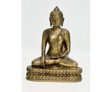 A Late 19th Century Tibetan brass Buddha Shakyamuni seated statue. 16x10x20cm