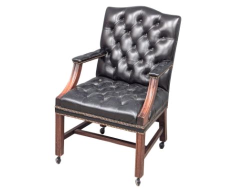A Gainsborough style deep button back leather armchair