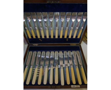A Silver Plated Twelve Piece Fish Service by Walker &amp; Hall Sheffield, Comprising of twelve knifes, twelve forks, with bon
