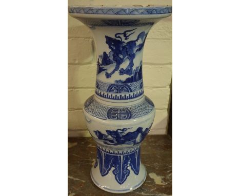 A Chinese Gu Shaped Blue and White Pottery Vase, circa 19th century, Decorated with panels of mythical creatures and symbols,