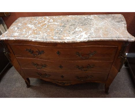 A French Louis XV Style Bombe Commode Chest, Having a detachable mottled marble top, above three graduated serpentine drawers