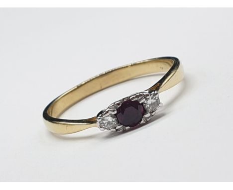 18ct yellow gold diamond and ruby 3 stone ring. Size S and weighs 2.66g. 