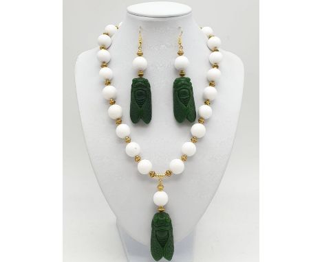 A vintage Chinese white jade beaded necklace with green jade cicadas, in a presentation box. Necklace length: 47cm, earrings 