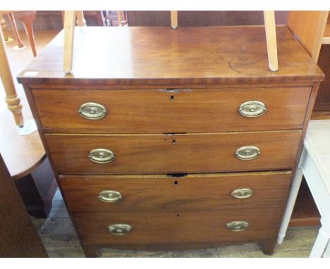 A 19th Century mahogany chest of four long drawers on bracket feet