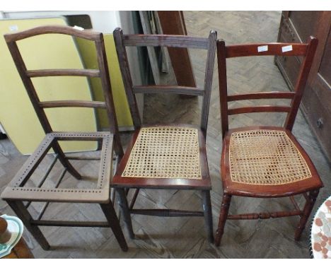 A pair of stick chairs and three cane seat chairs