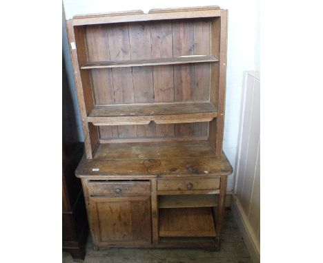 An open pine shelf back dresser