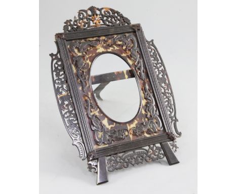 A Chinese tortoiseshell easel photograph frame, early 20th century, decorated with dragons and scrolling foliate, 26cm, some 
