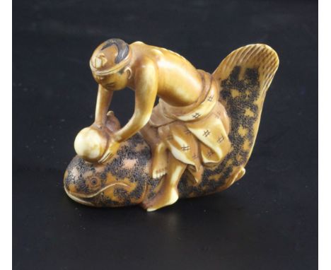 A Japanese ivory netsuke of a man riding a cat fish, 19th century, signed Shunkosai, the man holding a gourd, engraved three 