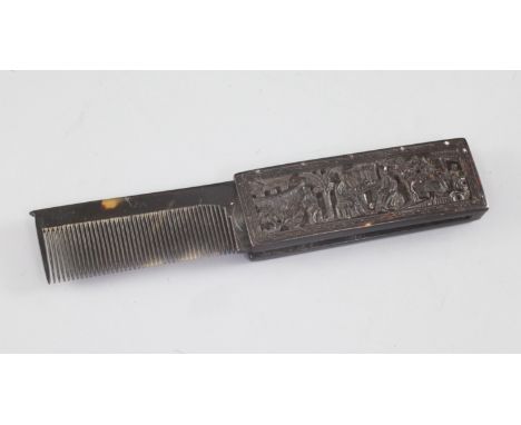 A Chinese export tortoiseshell fold out comb, 19th century, carved in relief with figures amid pavilions and trees and the mo