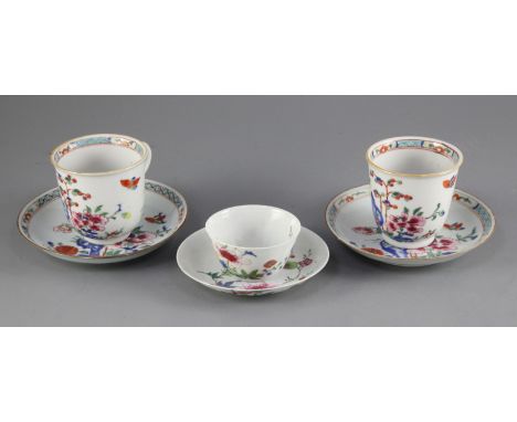 A pair of Chinese export famille rose chocolate cups and saucers and a similar teabowl and saucer, Qianlong period, the cups 